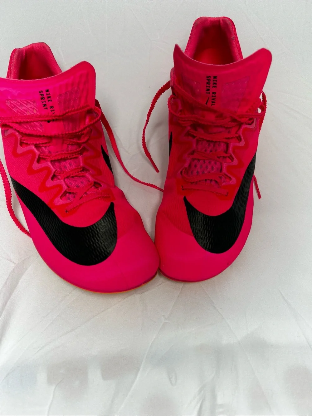 Nike Bright Pink Athletic track with Black Swoosh men’s 10/1/2